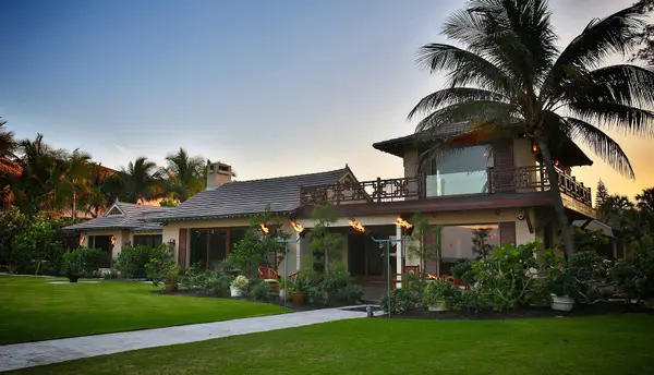 The front of the zen house with a sunset occurring behind it.