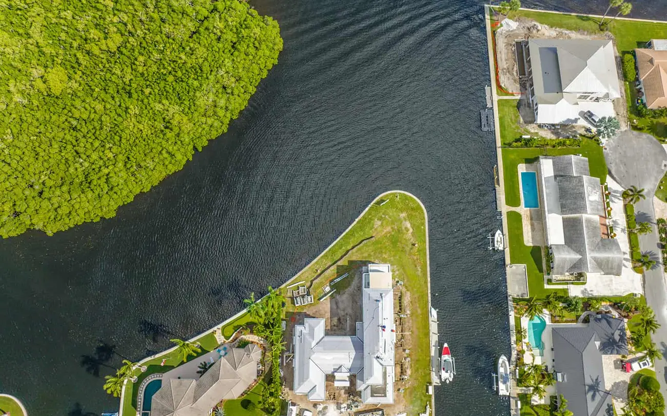 View of a waterfront home under construction, seen from above