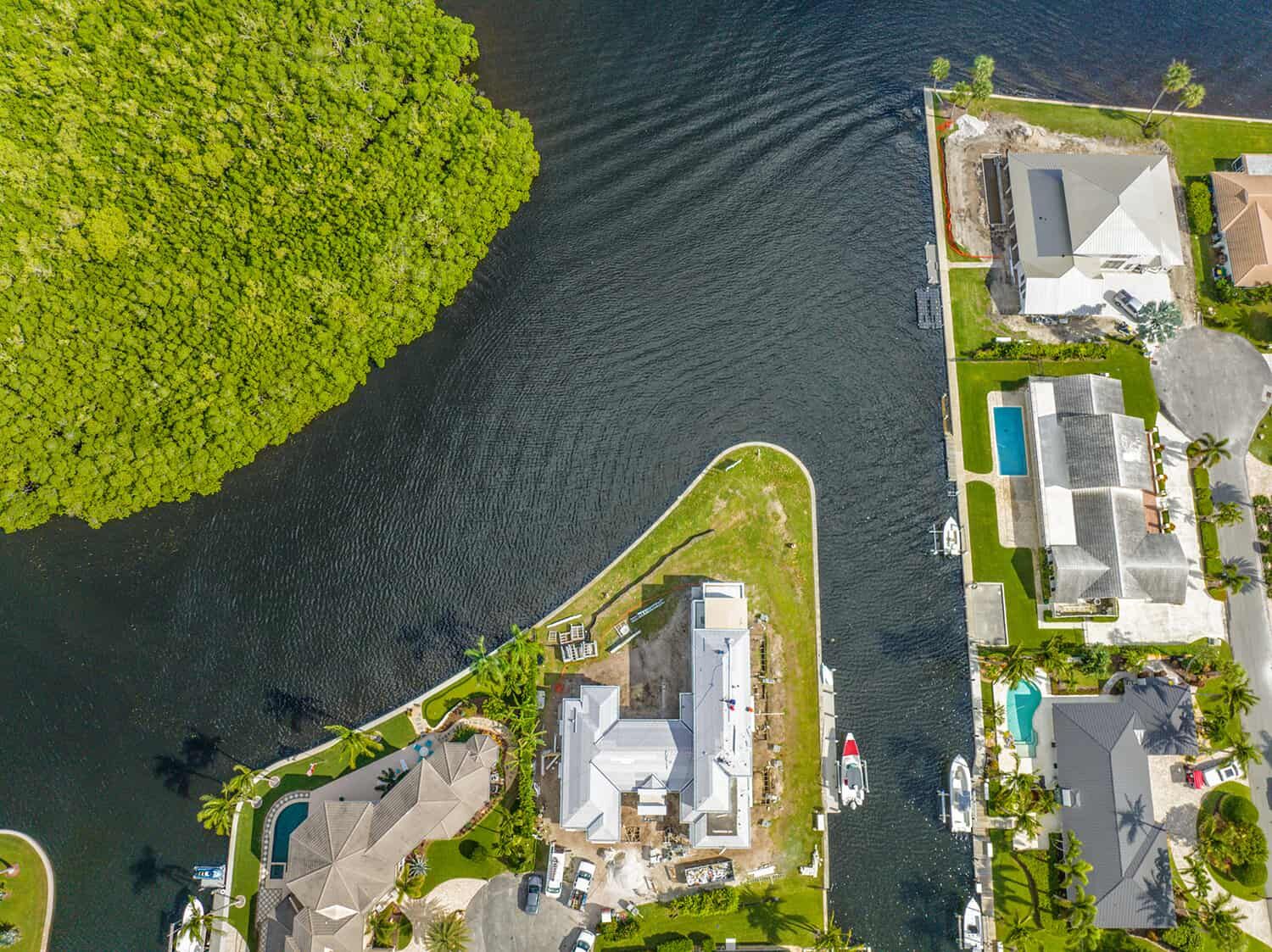 View of a waterfront home under construction, seen from above