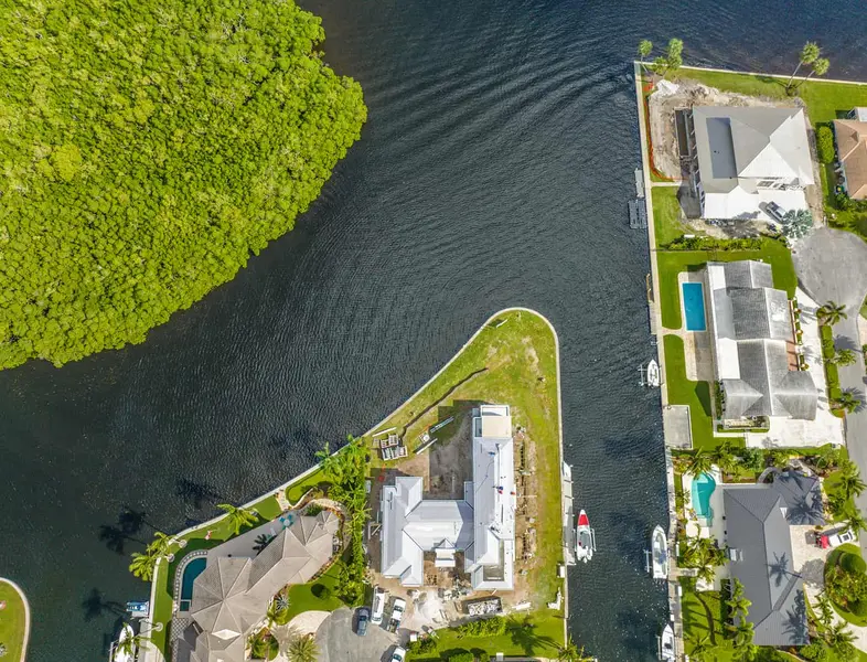 View of a waterfront home under construction, seen from above