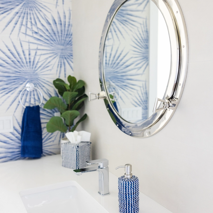 nautical office bathroom with port hole mirror