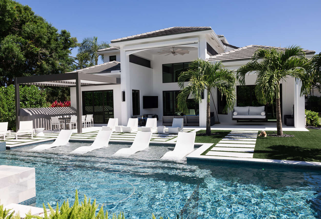 Luxury backyard with pool and seating area