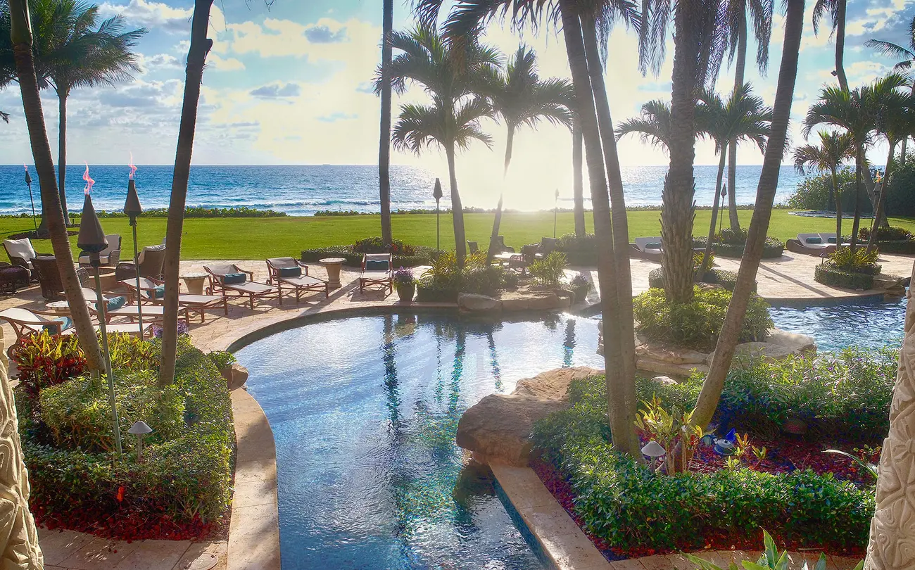 pool overlooking ocean sunset in lite up the night