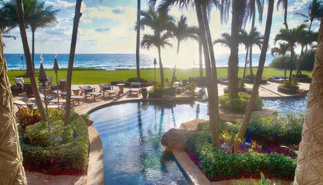 pool overlooking ocean sunset in lite up the night