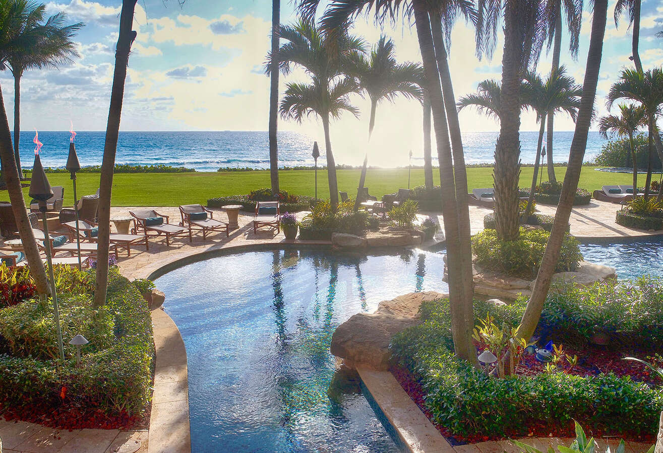 pool overlooking ocean sunset in lite up the night