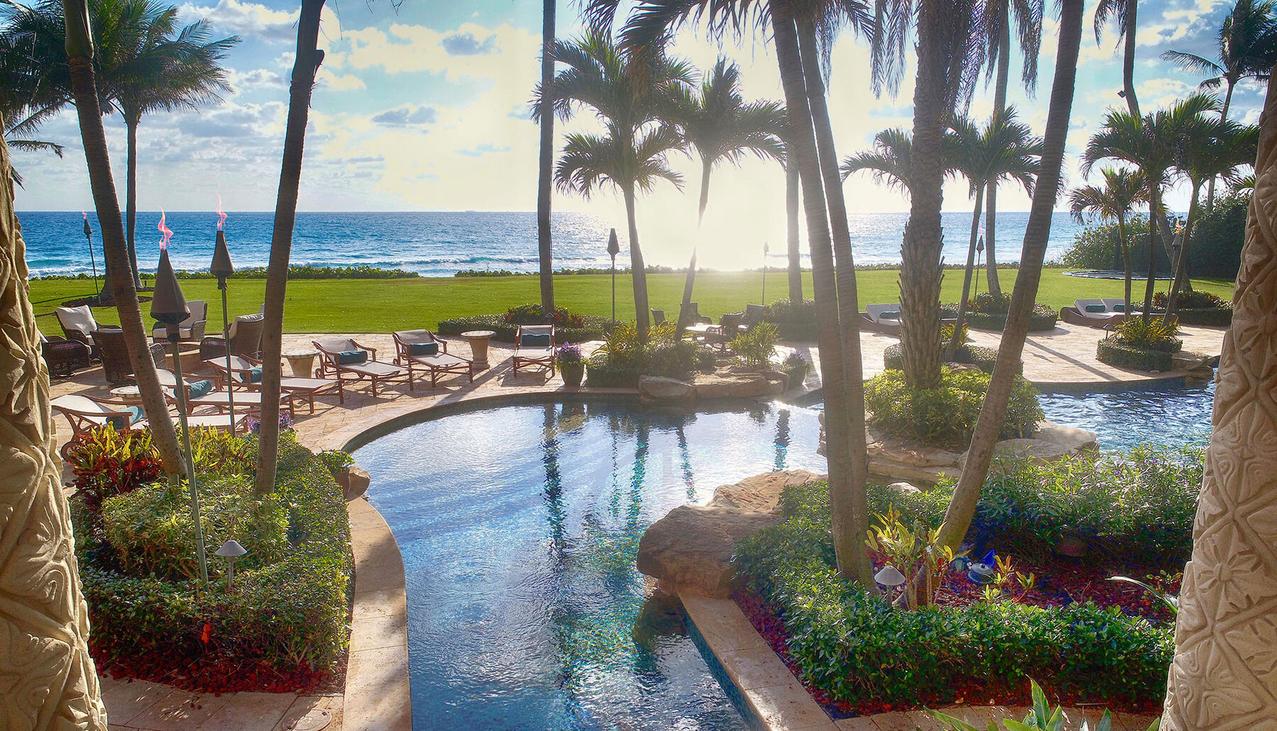 pool overlooking ocean sunset in lite up the night
