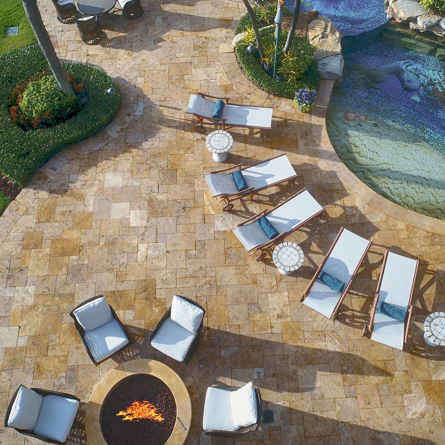 aerial view of seating area and pool of lite up the night