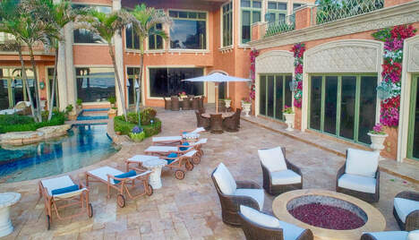 elegant look of seating area, pool and home of lite up the night