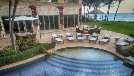 pool overlooking the ocean in lite up the night