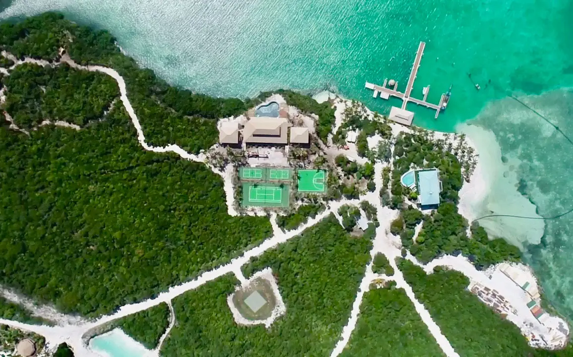 A bird's eye view of the private island retreat, with its three tennis courts and basketball court on big grand cay