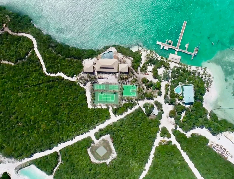 A bird's eye view of the private island retreat, with its three tennis courts and basketball court on big grand cay