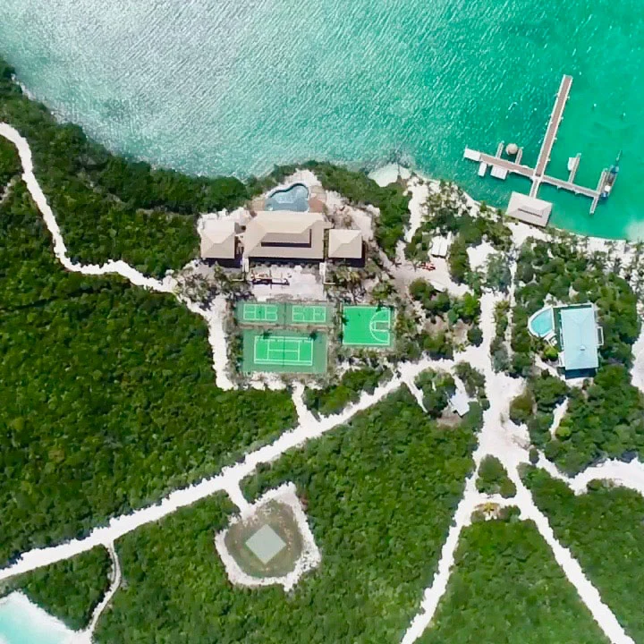 A bird's eye view of the private island retreat, with its three tennis courts and basketball court on big grand cay