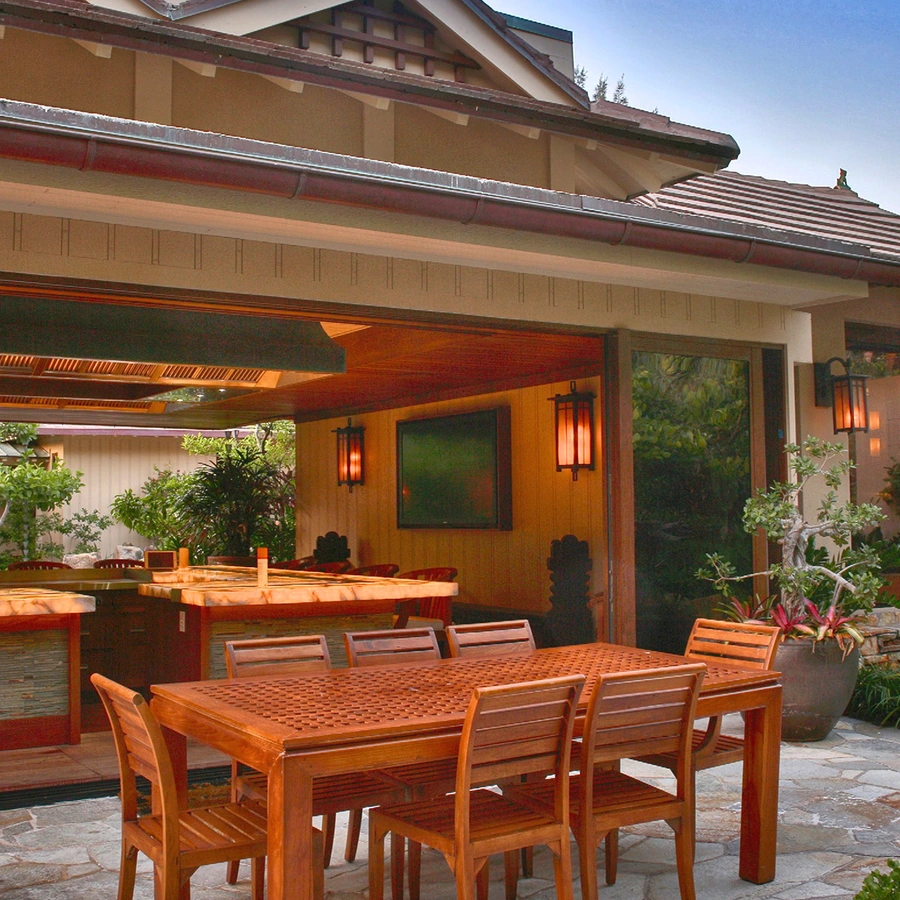 outside table with a beautiful inside kitchen